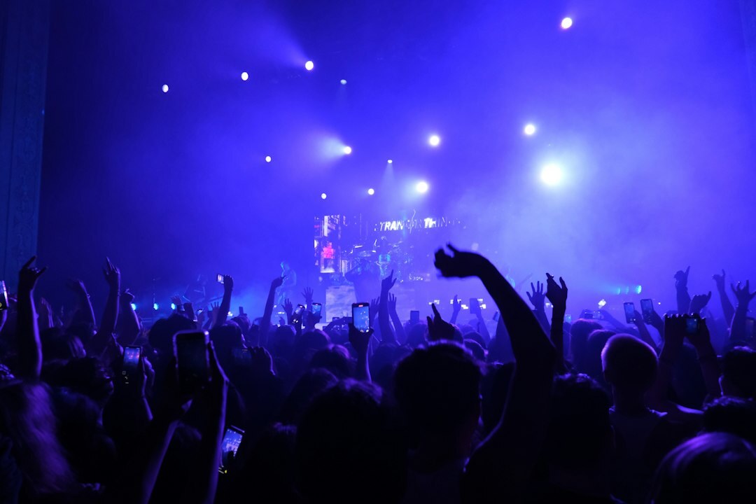 Live concert stage with colorful lights and crowd